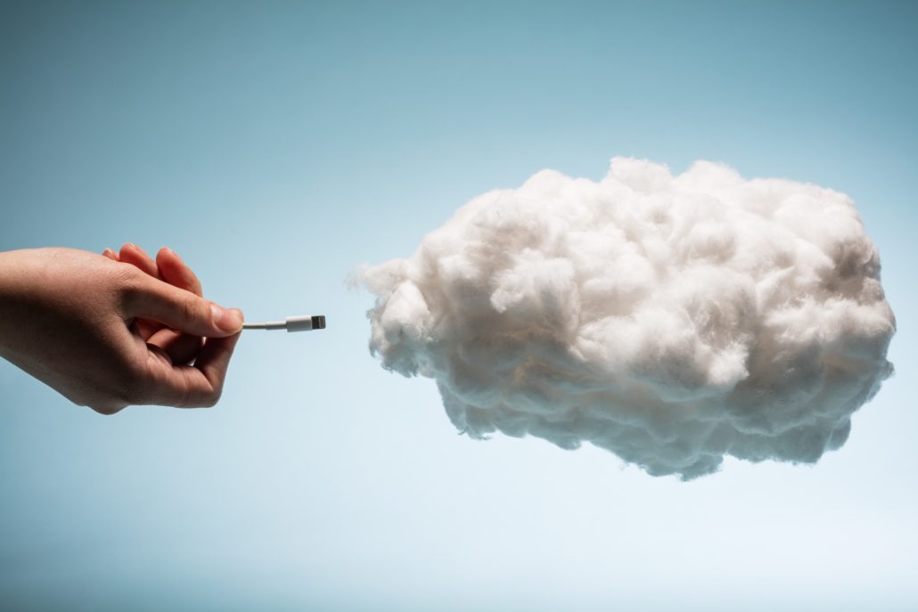 woman s hand plugging a wire into a white cloud 2021 08 26 22 41 11 utc 1