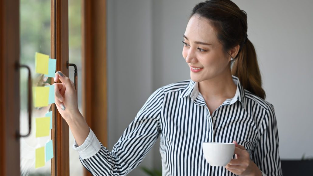 smiling female leader drinking coffee and pointing 2022 05 09 22 57 53 utc
