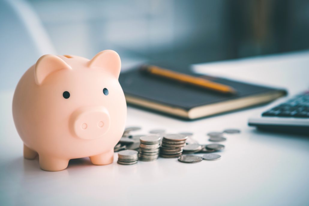 piggy bank among coins 2022 08 01 03 19 01 utc
